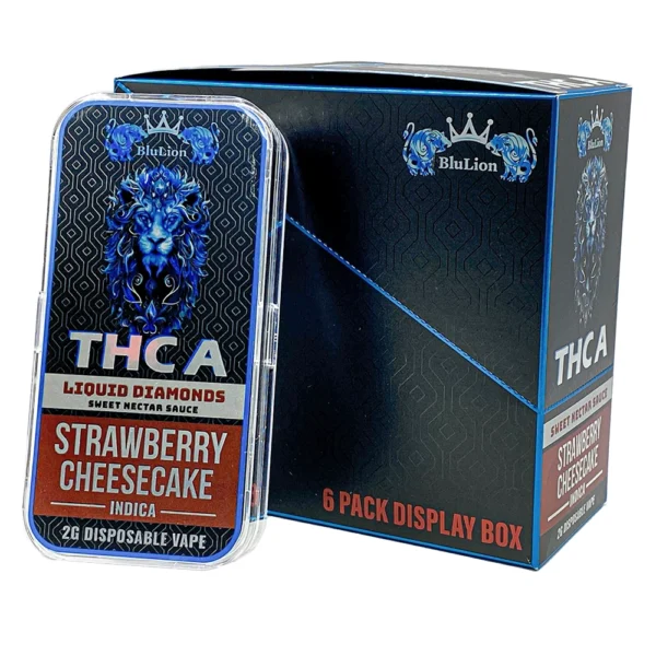 BluLion THCA Liquid Diamonds Disposable Vape – Strawberry Cheesecake flavor (Indica), 2g cartridge shown in front of branded 6-pack display box.